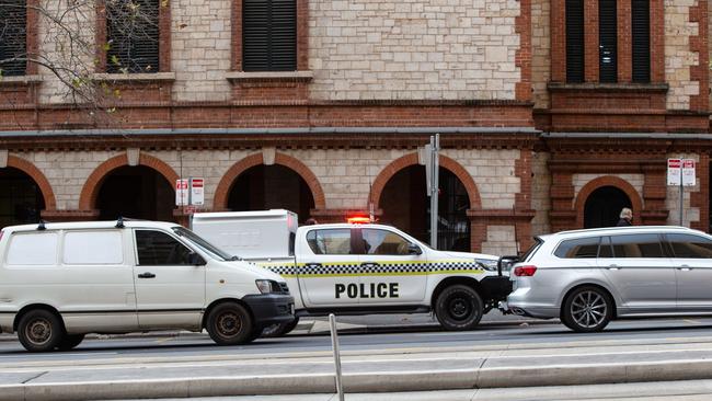 Police outside Parliament on North Tce. Picture: Brett Hartwig