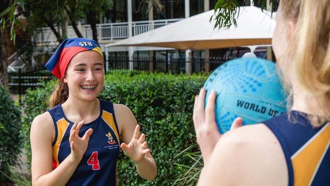 St Hilda’s School 2018 Athletics Co-Captain Keely Whittaker is sharing her love of sport with younger students like Jessica Jolly. Photo: Daniel Snare