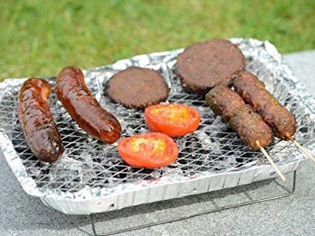 Wrong tongs and coal in a tin foil tray are just a couple of British barbecue oddities. Picture: Supplied