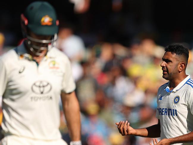 ADELAIDE, AUSTRALIA - DECEMBER 07: Ravichandran Ashwin of India reacts after dismissing Mitch Marsh of Australia during day two of the Men's Test Match series between Australia and India at Adelaide Oval on December 07, 2024 in Adelaide, Australia. (Photo by Robert Cianflone/Getty Images)