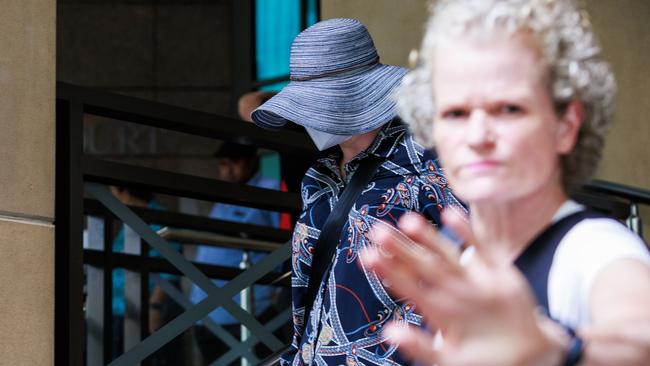 Matilda McDermott, wearing a hat and face mask, leave the Melbourne Magistrates court. Picture: NewsWire / Aaron Francis.