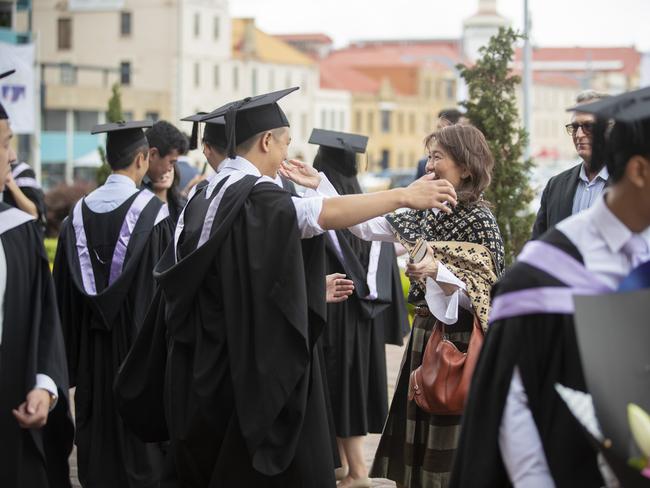 Michell Tan hugs his mother Patricia Chew. UTAS graduations. School of College of Health and Medicine Graduate Research. Picture: RICHARD JUPE