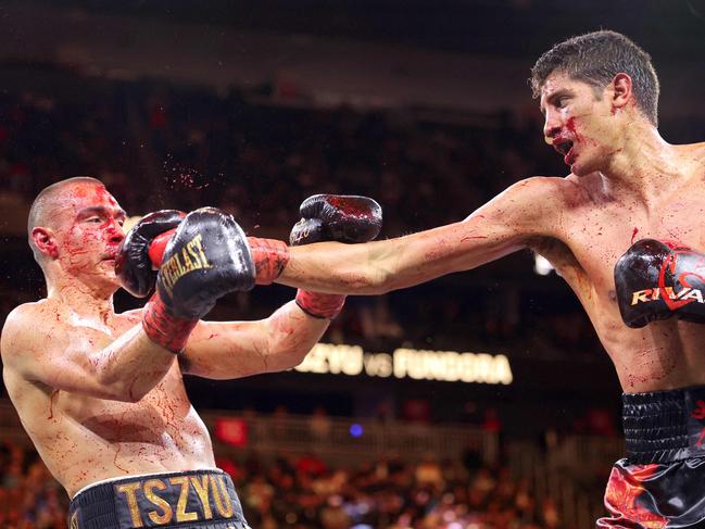 LAS VEGAS, NEVADA - MARCH 30: WBO junior middleweight champion Tim Tszyu (L) takes a punch from Sebastian Fundora during the ninth round of a title fight at T-Mobile Arena on March 30, 2024 in Las Vegas, Nevada. Fundora won Tszyu's title and a vacant WBC title by split decision.   Steve Marcus/Getty Images/AFP (Photo by Steve Marcus / GETTY IMAGES NORTH AMERICA / Getty Images via AFP)