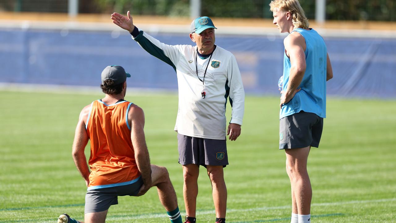 Eddie Jones talks to Ben Donaldson and Carter Gordon during a Wallabies training session. Picture: Chris Hyde/Getty Images