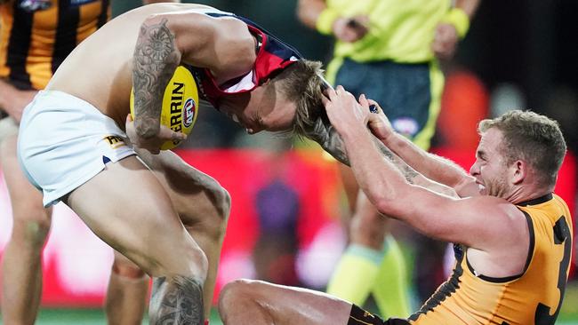 James Harmes is tackled by Tom Mitchell. Picture: AAP Image/Michael Dodge