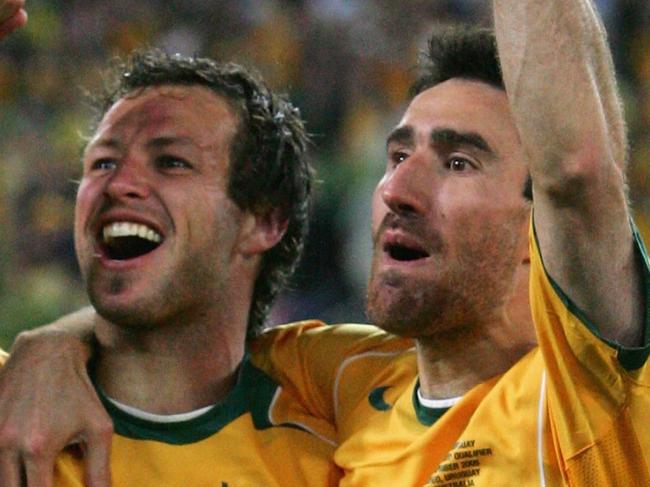 SYDNEY, NSW - NOVEMBER 16:  Lucas Neill #2 and Tony Vidmar #5 for the Socceroos celebrates after winning the second leg of the 2006 FIFA World Cup qualifying match between Australia and Uruguay at Telstra Stadium November 16, 2005 in Sydney, Australia.  (Photo by Robert Cianflone/Getty Images)