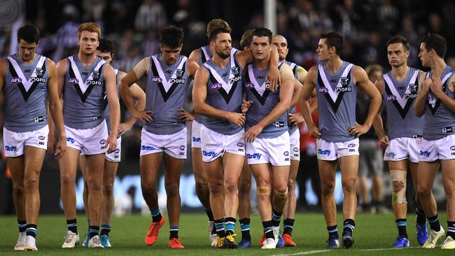 Power players leave the field after failing to get up for Travis Boak, middle, in his 250th game on Friday. Picture: AAP Image/Julian Smith