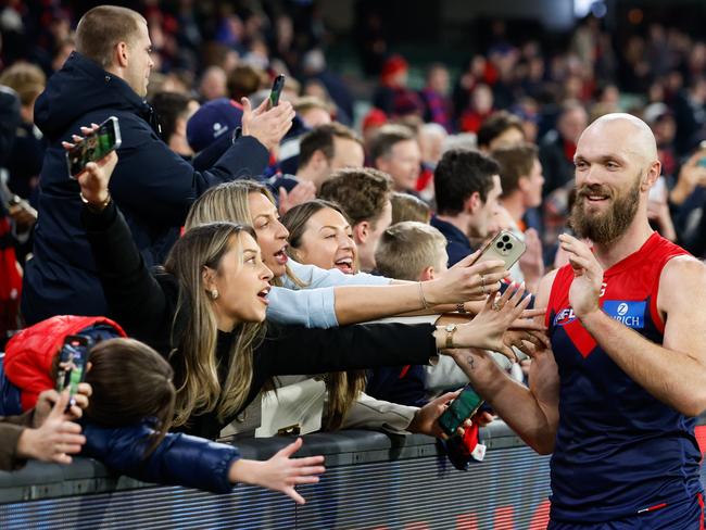 Max Gawn of the Demons is offered a phone by fans. Picture; Getty Images