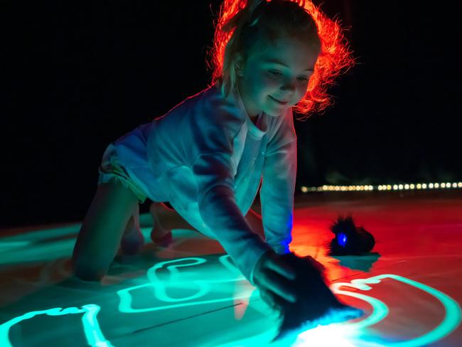 A child enjoys art installation Sea of Light, which will form part of next month’s Ten Days on the Island festival in Tasmania. Picture: Matt Byrne