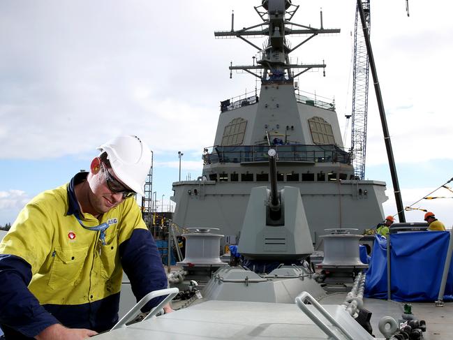 14/05/15 Mechanical fitter Chris Swain works on the first Air Warfare Destroyer built in Adelaide, the Hobart which is to be launched later this month at its Outer Harbor ship yard. photo Calum Robertson