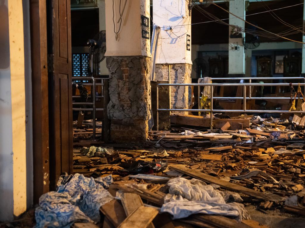 Debris and bomb damage are pictured inside St Anthony's Shrine from behind a police cordon. Picture: Getty