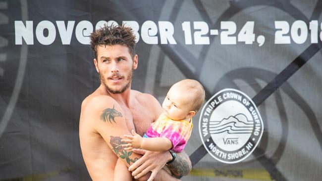 Jack Freestone and his 2 year old baby boy Banks at Haleiwa, Hawaii balancing parent duties with professional surfing. Please give full credit to photo by Heff/WSL.