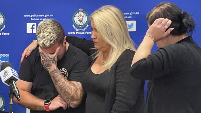 An emotional Jesse McNabb at the press conference in which police announced a $500,000 reward following the murder of his father Paul Strangio at Glenmore Park in 2010. He is with his mum and sister Catrina and Jasmine McNabb.