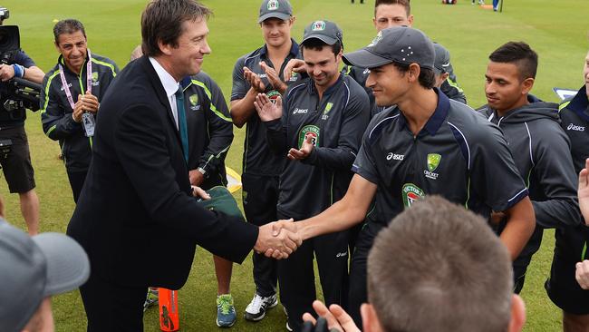 Ashton Agar of Australia receives his Baggy Green from Glenn McGrath in Nottingham.