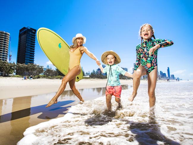 Kit Wise with her kids Indigo, 7 and Jagger, 3 at Broadbeach beach on the Gold Coast. Picture: Nigel Hallett