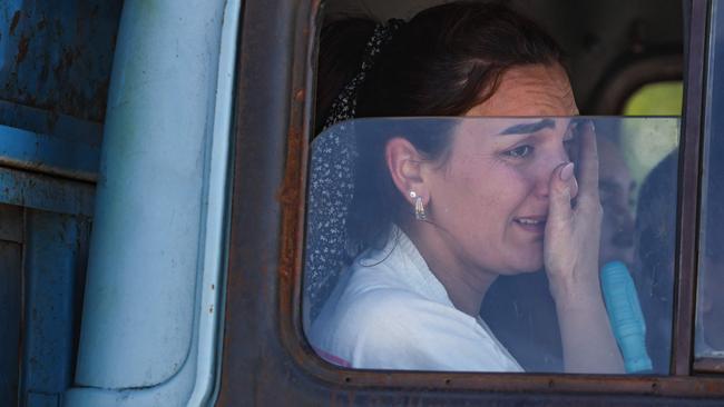 Tears after crossing the border near Kornidzor on Wednesday. Picture: AFP