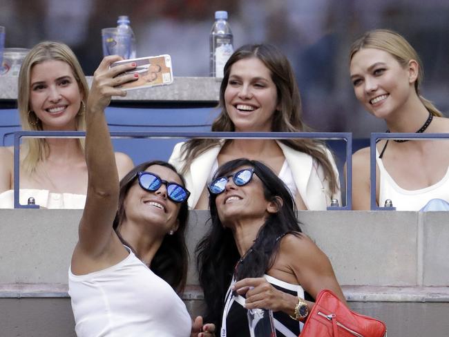 Two spectators take a selfie with Ivanka Trump and Karlie Kloss at the Men’s Singles Final Match between Novak Djokovic of Serbia and Stan Wawrinka of Switzerland on Day Fourteen of the 2016 US Open. Picture: AP