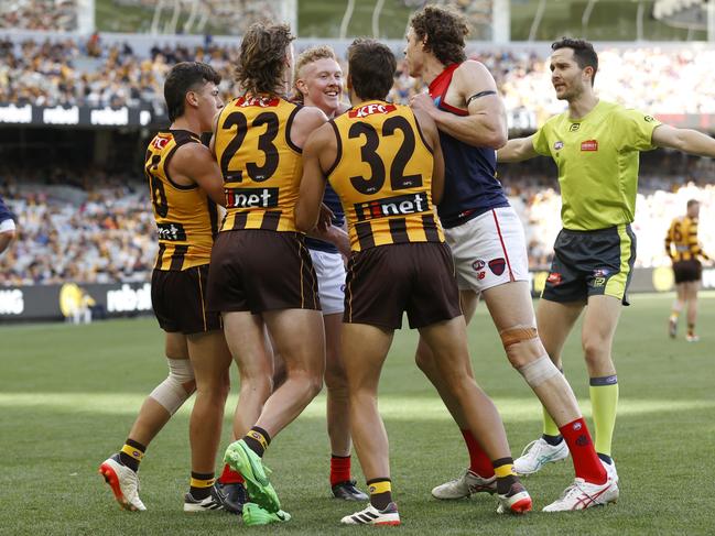 Clayton Oliver of the Demons wrestles Hawks players during the round two AFL match between Hawthorn Hawks and Melbourne Demons. (Photo by Darrian Traynor/Getty Images)