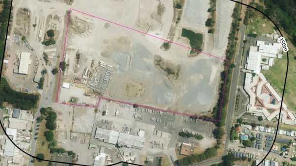 An aerial photo showing the proximity of the schools (right) and the proposed construction support site (left).