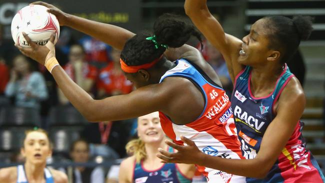 Sam Wallace hangs tough against Vixens player Kadie Ann Dehaney. 