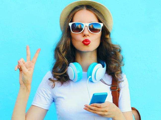 A woman is who using her smartphone while on holiday. Picture: iStock.