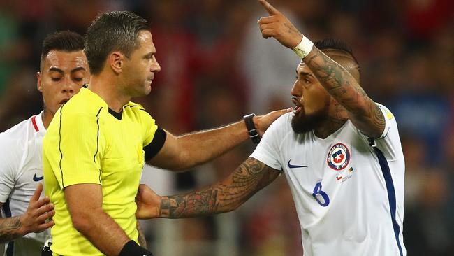 Arturo Vidal of Chile appeals to referee Damir Skomina after Chile's goal was disallowed.