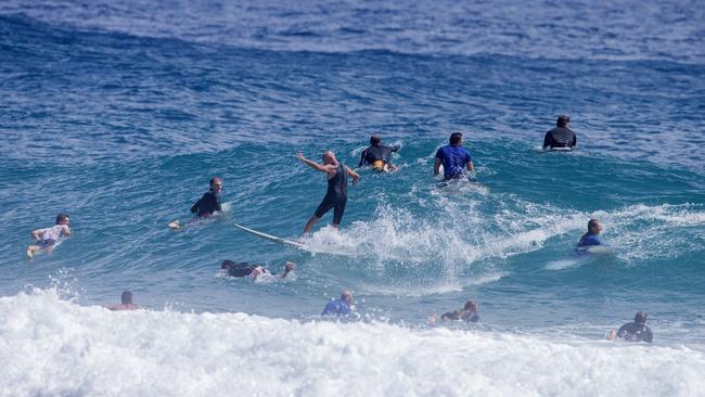 Surfers having to ride through other surfers as large swell brings large crowds to Snapper Rocks on Sunday 2 January 2022. Picture: Jerad Williams