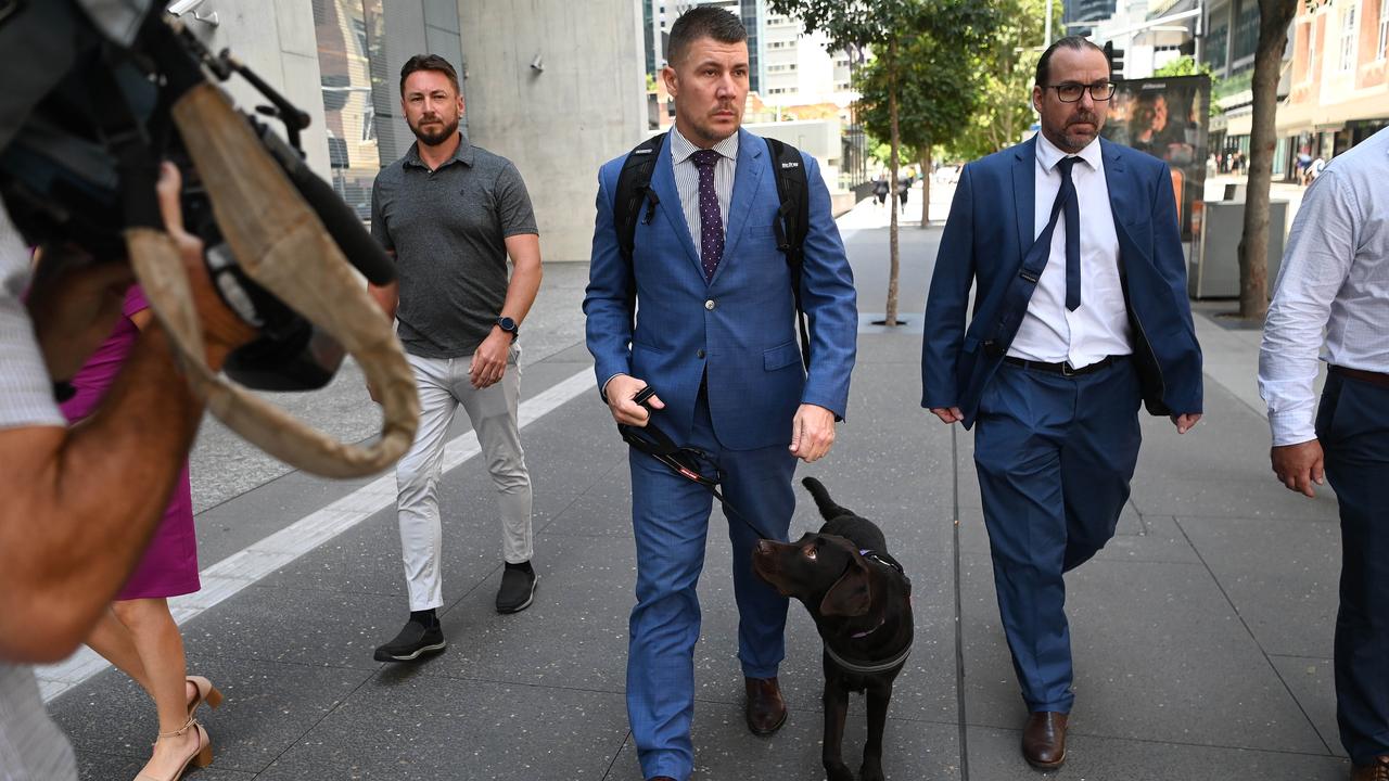 Irving was supported in the dock by his two-year-old assistance dog, a chocolate labrador named Legend. Picture: NCA Newswire / Dan Peled