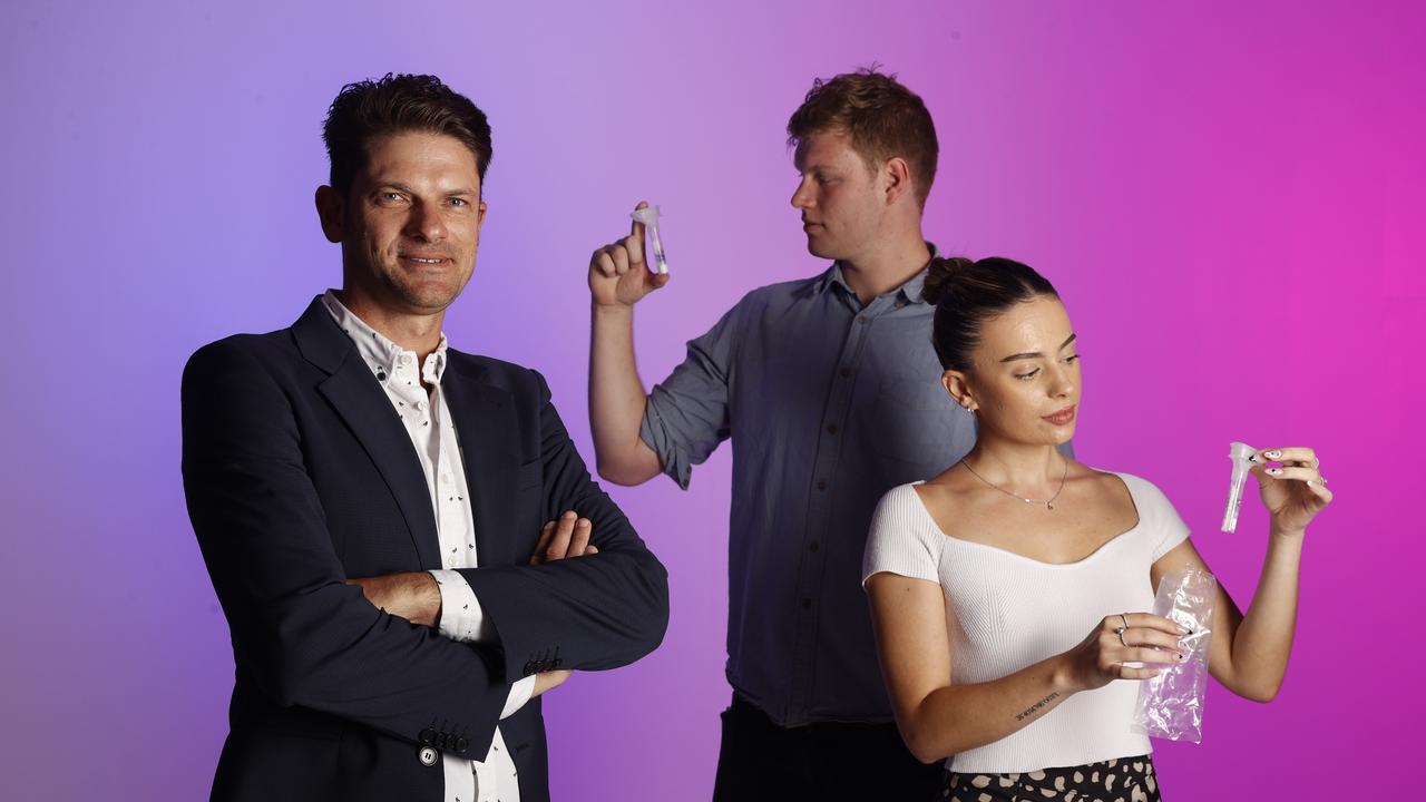 Paul Lacaze, Associate professor at Monash University, with Sam McLarty and Olivia Jenkins holding the NDA testing kits. Picture: Alex Coppel