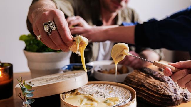 Gooey goodness: Dipping in with cheesemaker siblings Sam and Ellie Studd.