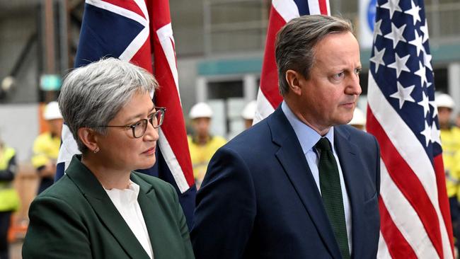 Penny Wong and Britain’s Foreign Secretary David Cameron at a tour of the Osbourne Naval Shipyards and Australian Submarine Corporation facilities in Adelaide.