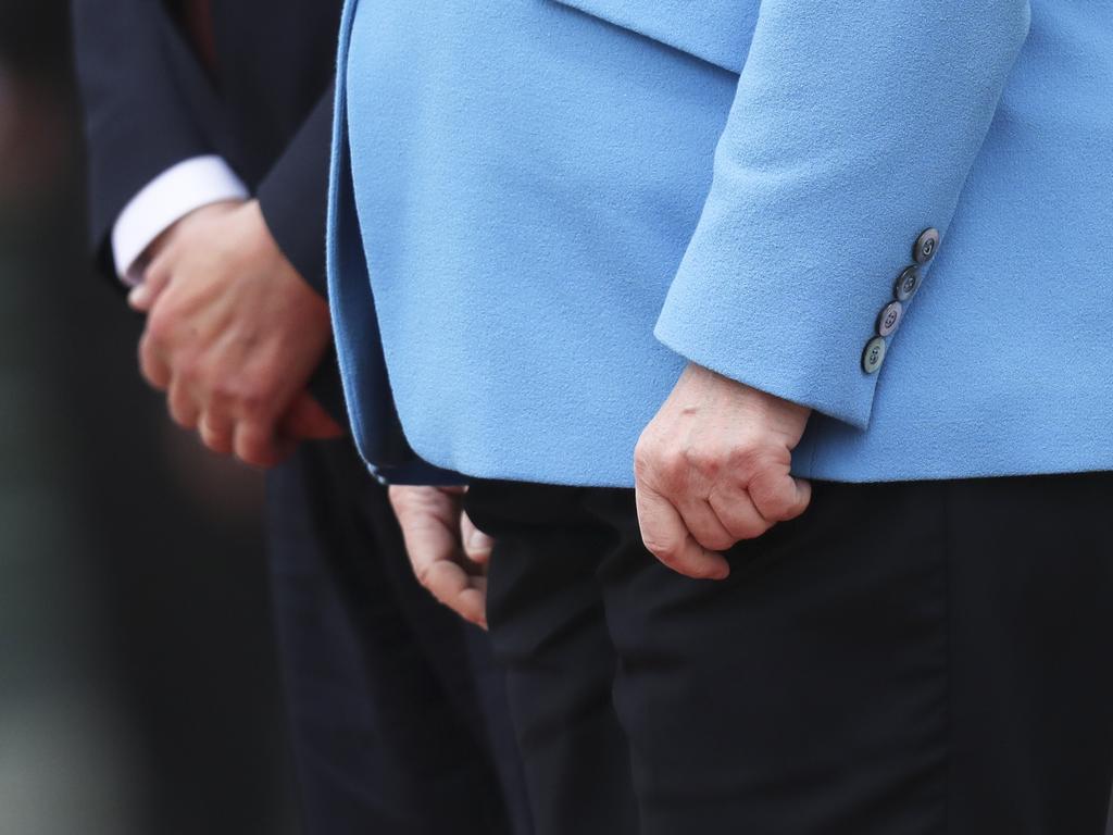 The hands of German Chancellor Angela Merkel, right, and Finland's Antti Rinne as they listen to the national anthems at the chancellery in Berlin. Picture: AP /Markus Schreiber