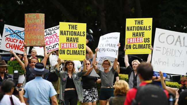 Protesters wait for Scott Morrison outside the Lismore Emergency Operations Centre in Goonellabah. Picture: NCA NewsWire/Elise Derwin