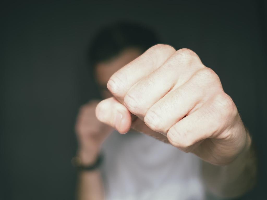 James broke away from his female friend and continued to punch Mr Johnson in the head.