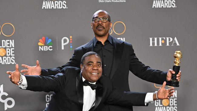 US actor Eddie Murphy (R) poses with the Cecil B. DeMille award alongside US comedian Tracy Morgan in the press room during the 80th annual Golden Globe Awards. Picture: AFP