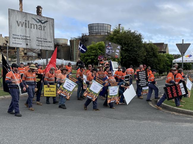 The striking workers, stationed outside the Plane Creek mill along the Bruce Highway, were unable to speak out alone for fear of repercussions from Wilmar. Photo: Fergus Gregg