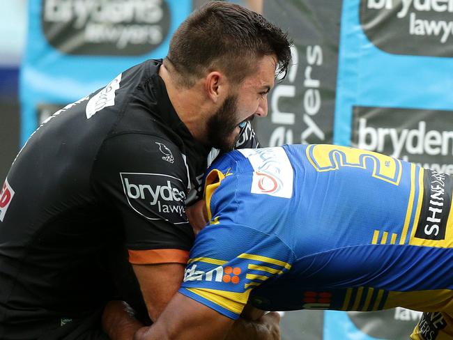 Tigers James Tedesco stops Parramatta's Michael Jennings from scoring a try during the Round 4 NRL game between the Wests Tigers and the Parramatta Eels at ANZ Stadium.Picture Gregg Porteous