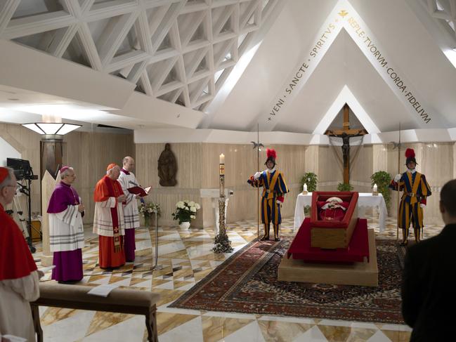 Pope Francis's body is laid out in state inside his private chapel at the Vatican, Monday, April 21, 2025. From left, Secretary of State Pietro Parolin, Master of Ceremonies Archbishop Diego Giovanni Ravelli, Cardinal Camerlengo Kevin Joseph Farrell, and Master of Ceremonies Lubomir Welnitz. (Vatican Media via AP, HO)