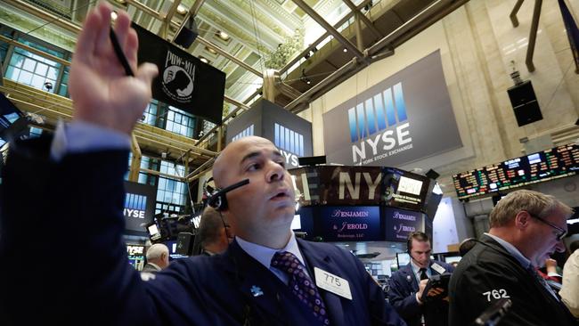 Trader Fred DeMarco, left, works on the floor of the New York Stock Exchange Thursday, Oct. 1, 2015. U.S. stocks started a new month lower a day after the market wrapped up its worst quarter in four years. (AP Photo/Richard Drew)