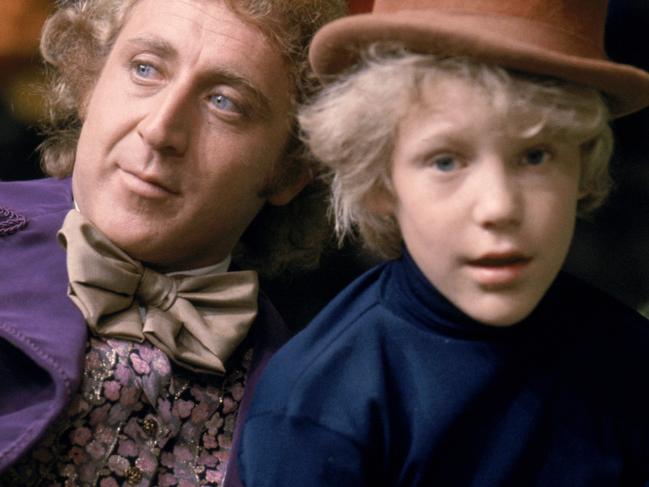 p119// Willy Wonka and the Chocolate Factory: Gene Wilder as Willy Wonka and Peter Ostrum as Charlie Bucket, wearing Wonka's top hat.