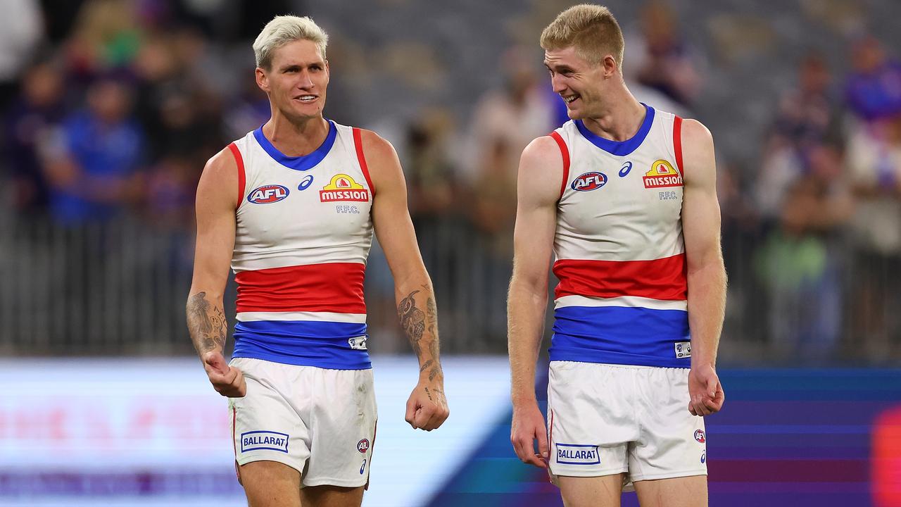 PERTH, AUSTRALIA - APRIL 21: Liam Jones, Rory Lobb and Tim English of the Bulldogs walk from the field after winning the round six AFL match between Fremantle Dockers and Western Bulldogs at Optus Stadium, on April 21, 2023, in Perth, Australia. (Photo by Paul Kane/Getty Images)