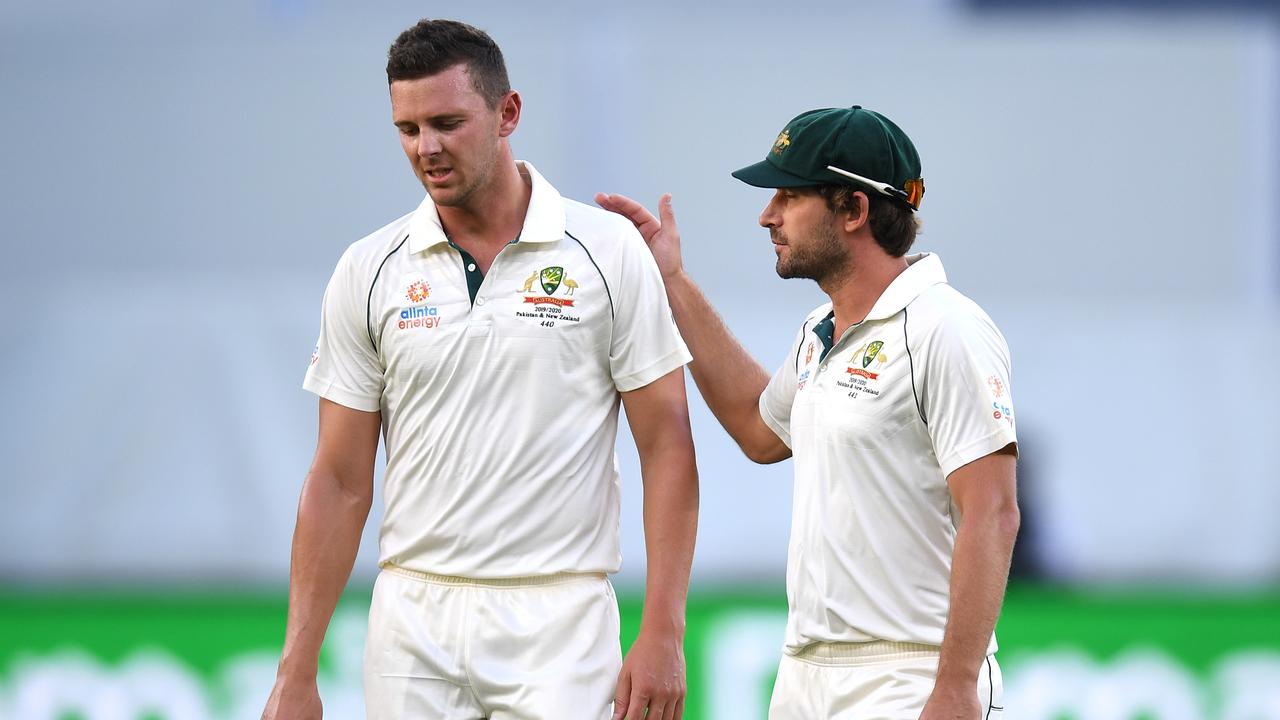 Josh Hazlewood leaves Perth Stadium after suffering a hamstring injury.