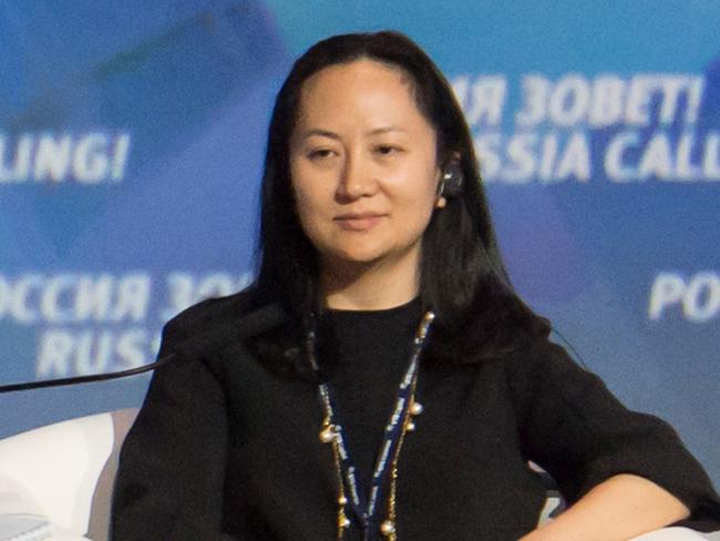 Russia's President Vladimir Putin (L) and Meng Wanzhou, Executive Board Director of the Chinese technology giant Huawei, attend a session of the VTB Capital Investment Forum "Russia Calling!" in Moscow, Russia October 2, 2014. Picture taken October 2, 2014. REUTERS/Alexander Bibik - RC1E784C06A0