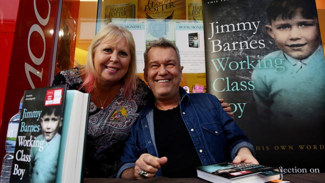 Rock icon Jimmy Barnes with big fan Tracee Irwin during his book signing at Dymocks Rouse Hill. Pictures: Peter Kelly