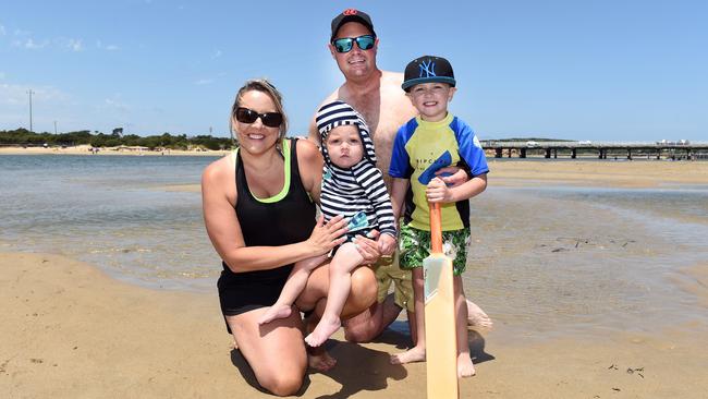 Kathy and Gay Hintum with Louie and Teddy at Barwon Heads beach. Picture: David Smith