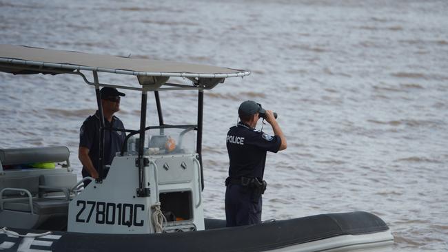 Police officers on the Fitzroy River. Photo Melanie Plane/The Morning Bulletin