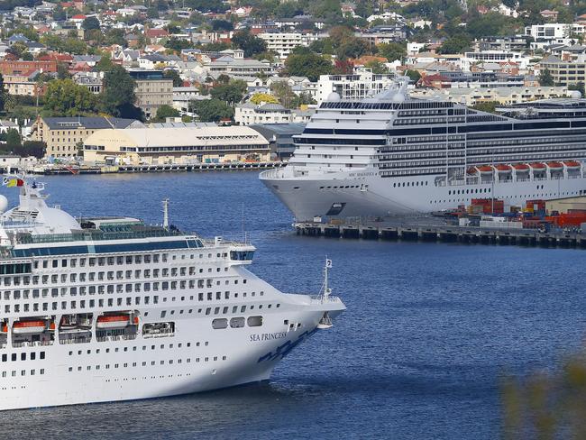 The MSC Magnifica, right, as the Sea Princess prepares to dock. Passengers aboard the Magnifica were not allowed to disembark. Picture: MATT THOMPSON