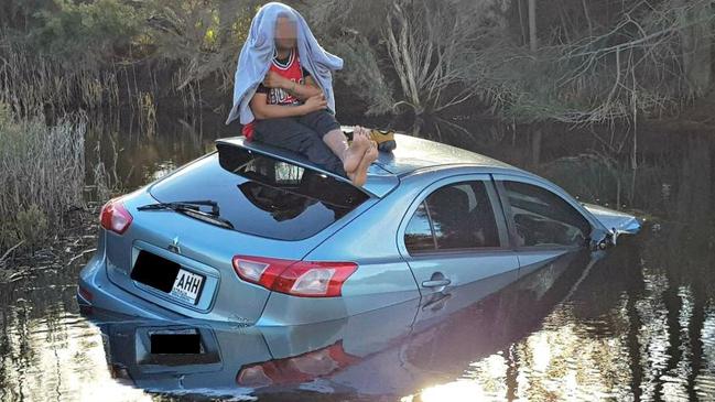 Police spoke to this driver after he was involved in a multi car crash on the Port River Expressway before crashing in the wetlands. Picture SA Police