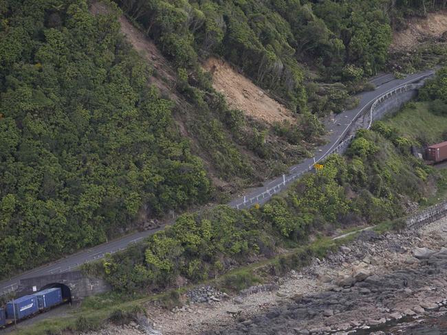 A freight train trapped by landslides near Kaikoura. Picture: AFP PHOTO / POOL / MARK MITCHELL