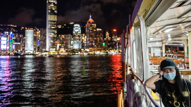 A woman on the Star Ferry in Victoria Harbour from Kowloon side to Hong Kong Island. Picture: AFP